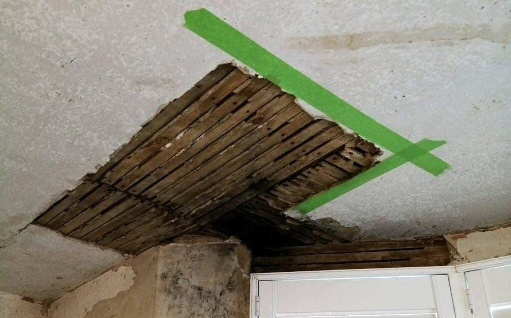 A lath and plaster ceiling in need of repair